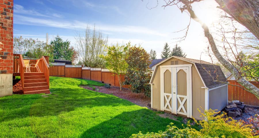 Fenced backyard with storage shed in Binghamton